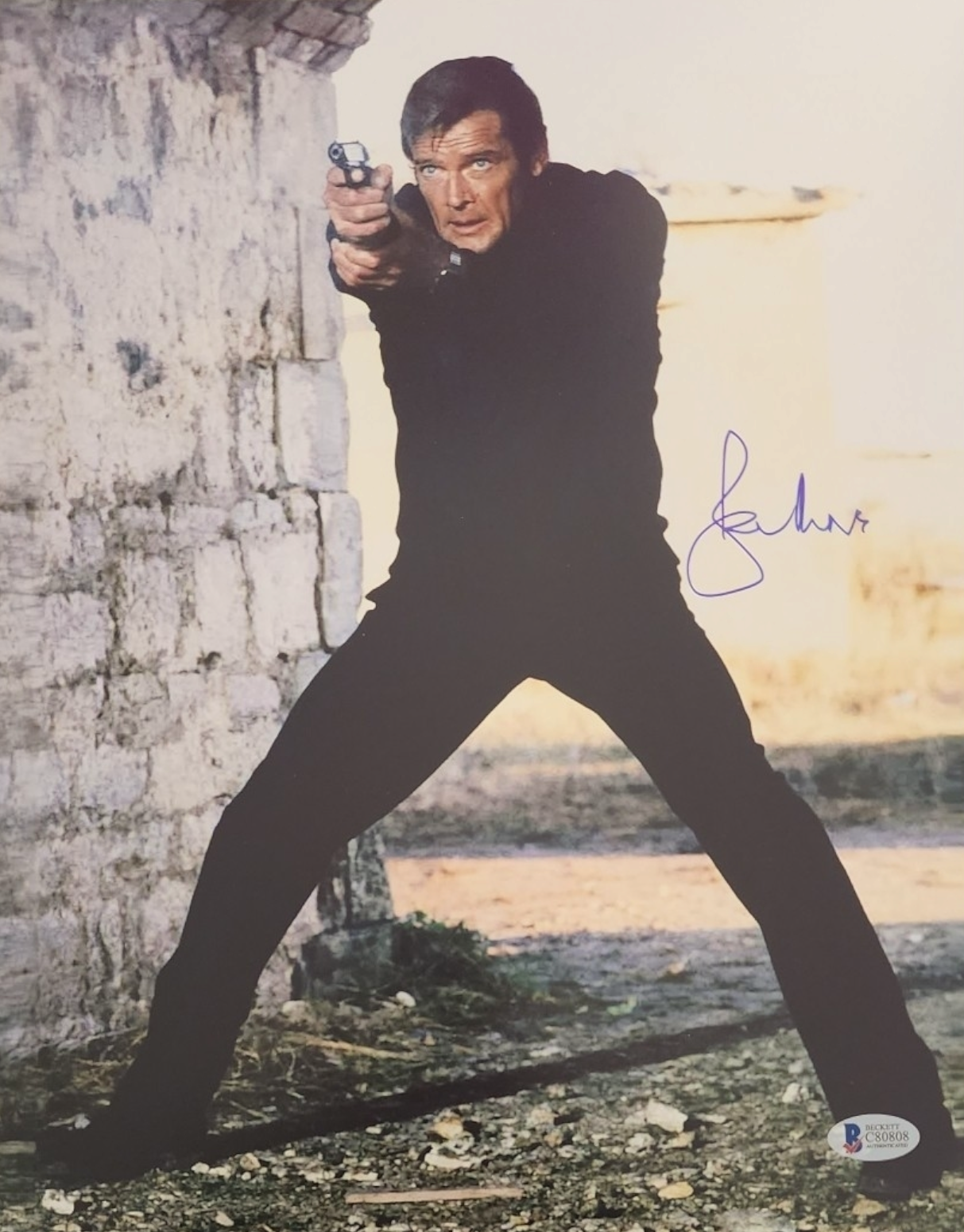 Roger Moore signed 11x14 James Bond "007" photo autographed Beckett COA